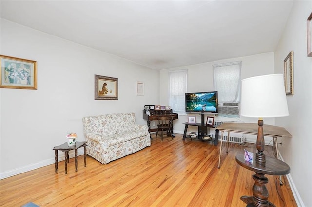 living room featuring baseboards and wood finished floors