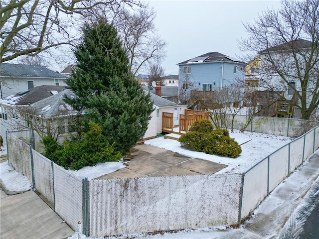 view of front of home featuring a fenced backyard and a deck