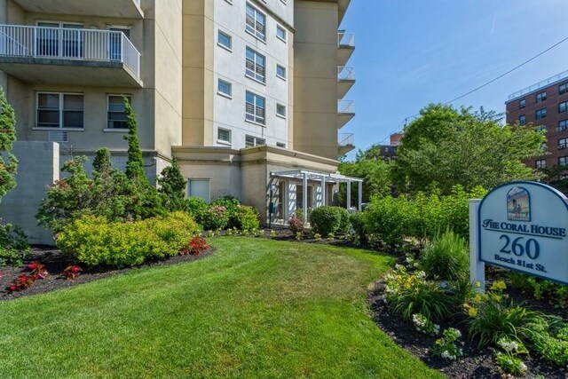 260 Bch 81st St Unit 4M, Rockaway Beach, NY 11693 - back of property featuring a lawn
