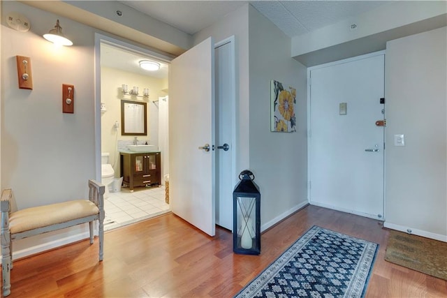 260 Bch 81st St Unit 4M, Rockaway Beach, NY 11693 - foyer entrance with wood finished floors and baseboards