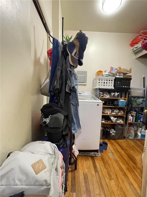 laundry area with washer / clothes dryer and hardwood / wood-style floors