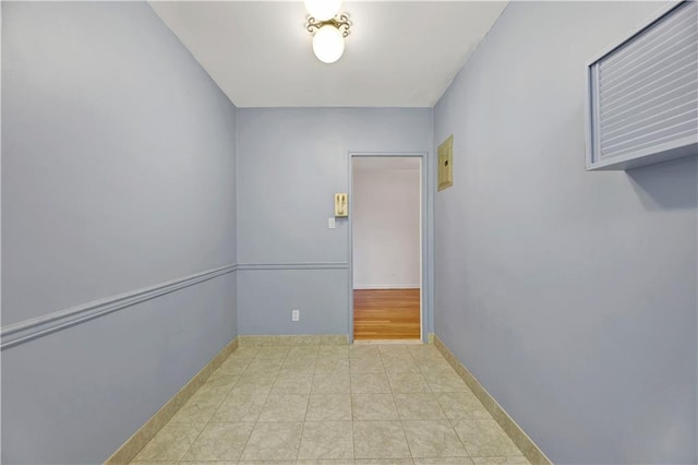 spare room featuring baseboards