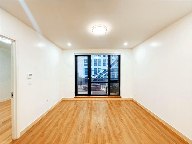 42-22 Crescent St Unit 2C, Long Island City, NY 11101 - spare room with light wood finished floors and recessed lighting