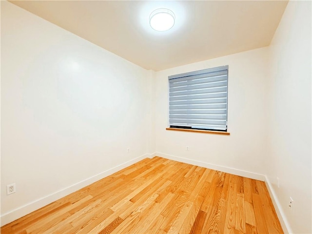 empty room featuring hardwood / wood-style flooring