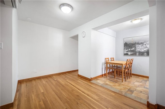 dining area featuring wood-type flooring