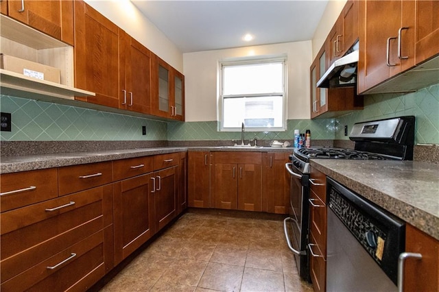 kitchen featuring tasteful backsplash, tile patterned floors, stainless steel appliances, and sink