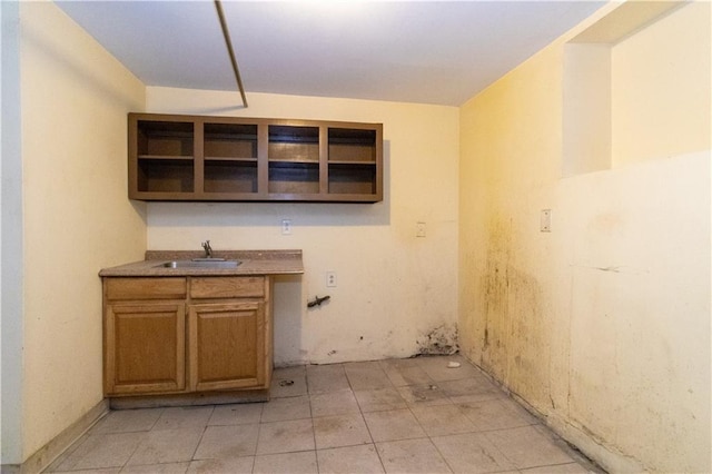 bar with sink and light tile patterned flooring