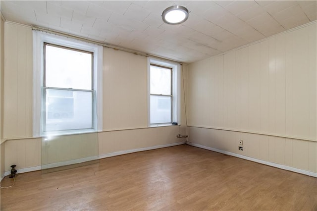 spare room featuring light hardwood / wood-style floors