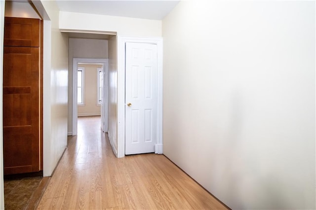 hall with light hardwood / wood-style floors