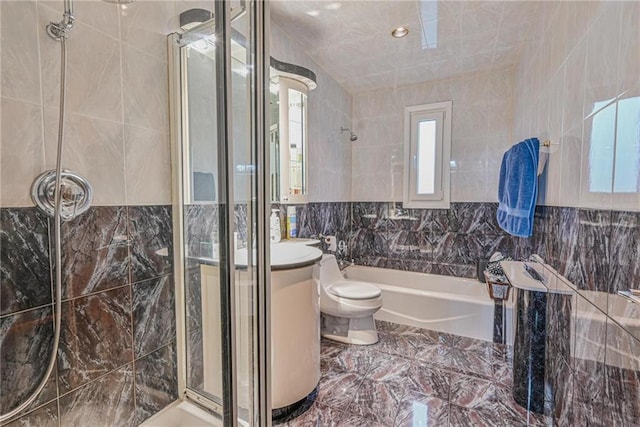 full bathroom featuring tile walls, vanity, independent shower and bath, and toilet