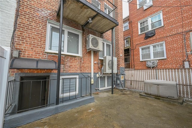 entrance to property with ac unit and an AC wall unit