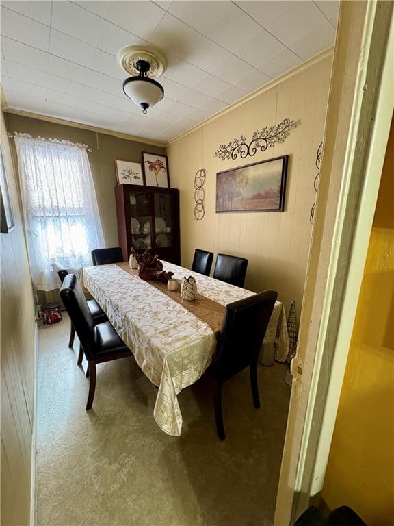 dining area with crown molding