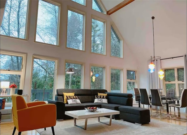 sunroom featuring vaulted ceiling and a wealth of natural light