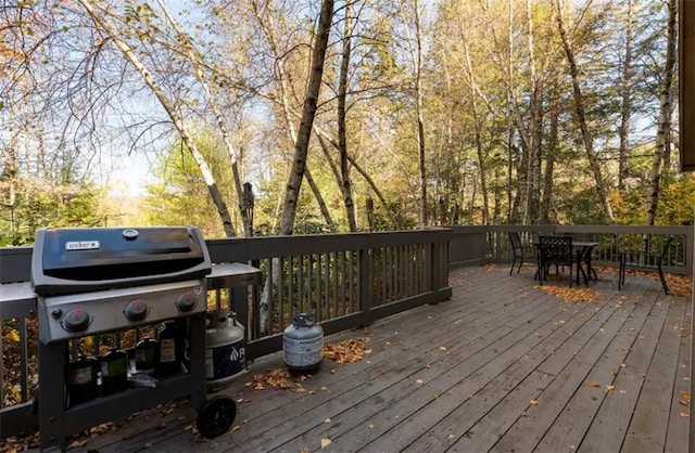 wooden terrace featuring grilling area