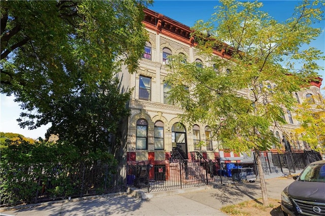 view of property featuring a fenced front yard