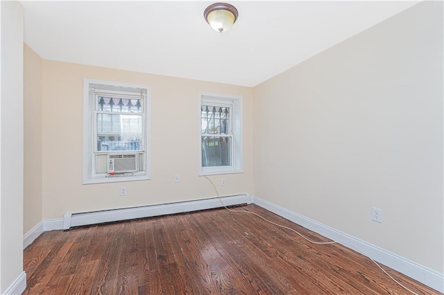 empty room featuring baseboards, cooling unit, baseboard heating, and dark wood-style floors