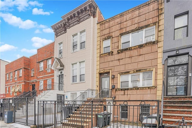 view of property featuring a fenced front yard and central AC