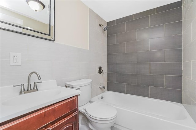 full bathroom featuring vanity,  shower combination, tile walls, and toilet