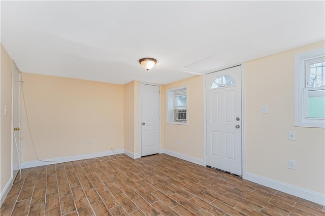 entrance foyer featuring baseboards and light wood-style floors