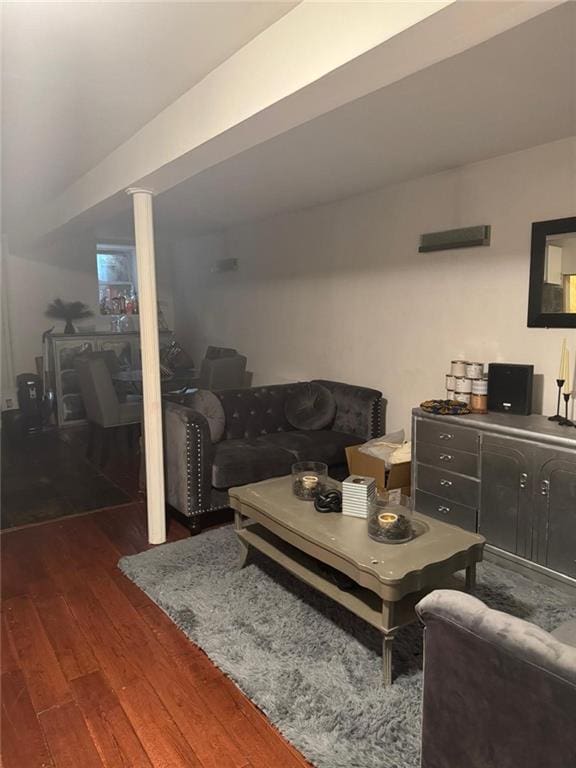 living room featuring dark wood-type flooring