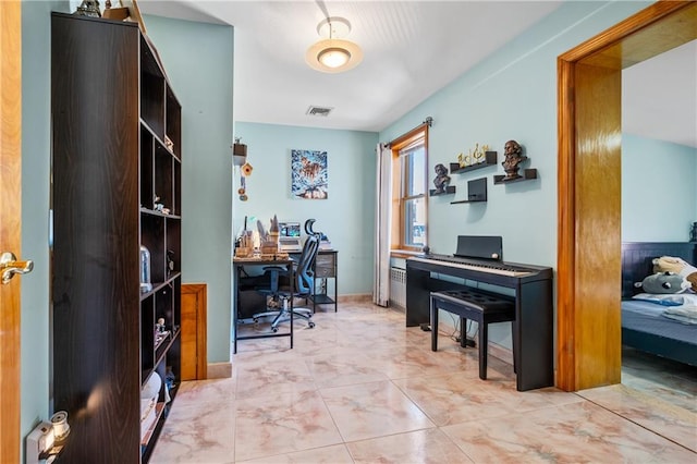 office space with visible vents and baseboards