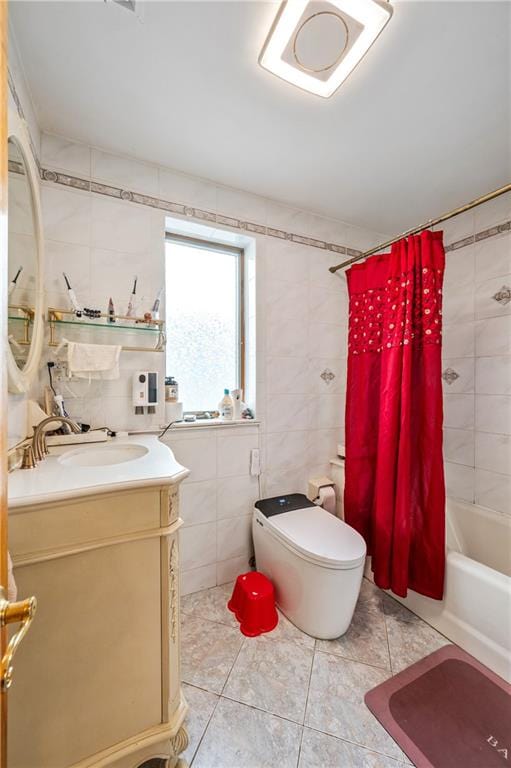 bathroom featuring tile patterned floors, toilet, tile walls, and vanity