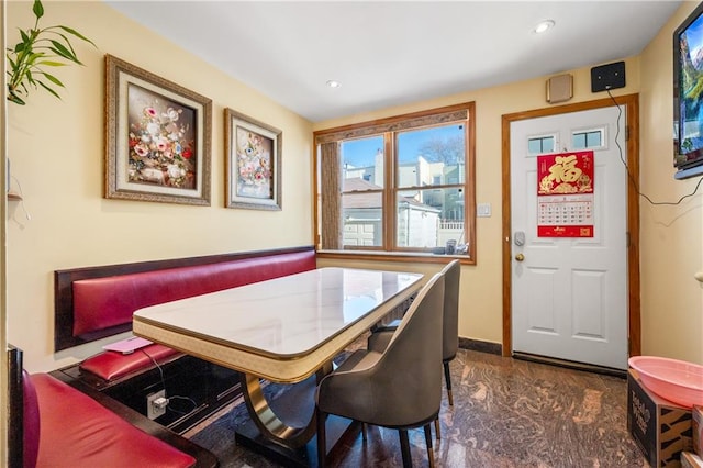 dining space with recessed lighting, marble finish floor, and baseboards