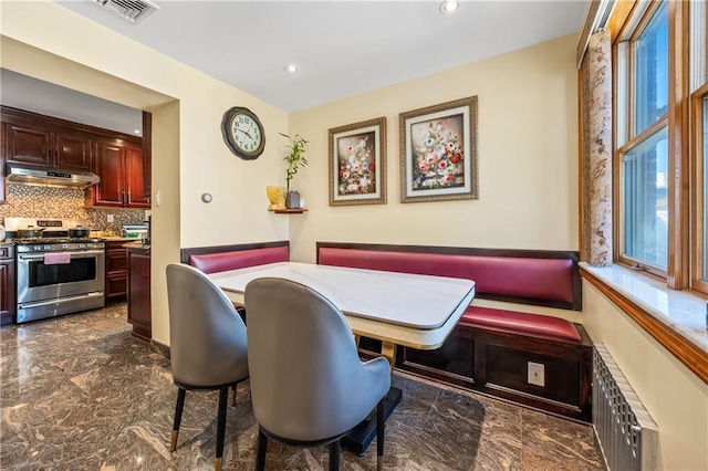 dining room featuring recessed lighting, visible vents, radiator, and marble finish floor