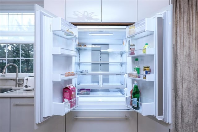 40 Oceana Dr W Unit 2G, Brooklyn, NY 11235 - kitchen view of open shelves, a sink, and light countertops