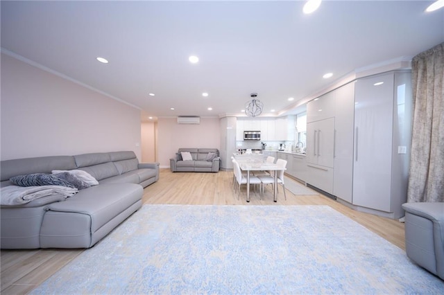 40 Oceana Dr W Unit 2G, Brooklyn, NY 11235 - living room featuring recessed lighting, a wall unit AC, ornamental molding, and light wood-style flooring