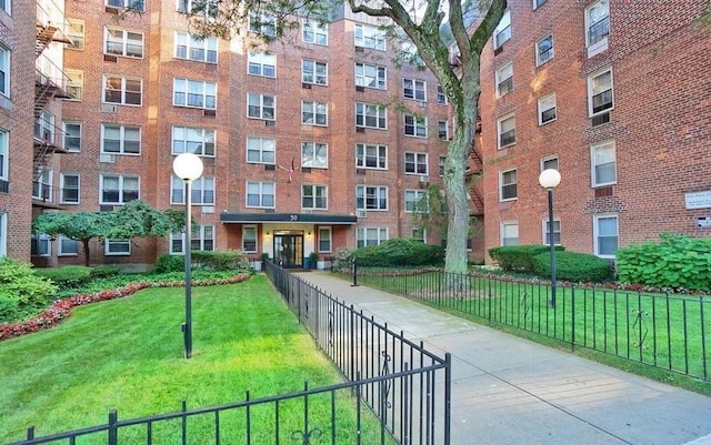 view of home's community with a lawn