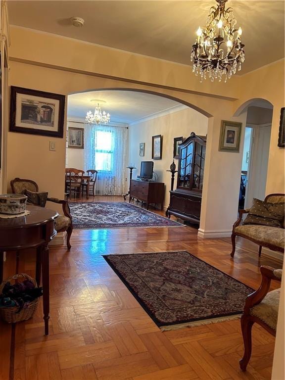 110 Shore Blvd Unit 4H, Brooklyn, NY 11235 - entrance foyer with arched walkways, a chandelier, baseboards, and ornamental molding