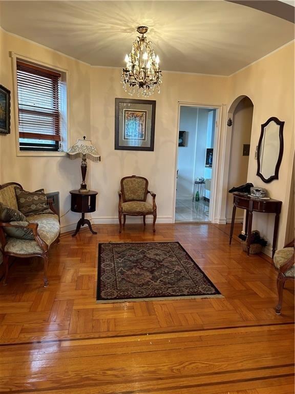 110 Shore Blvd Unit 4H, Brooklyn, NY 11235 - sitting room with a chandelier, arched walkways, and baseboards