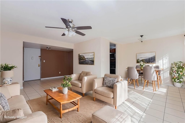 living room with light tile patterned floors and ceiling fan