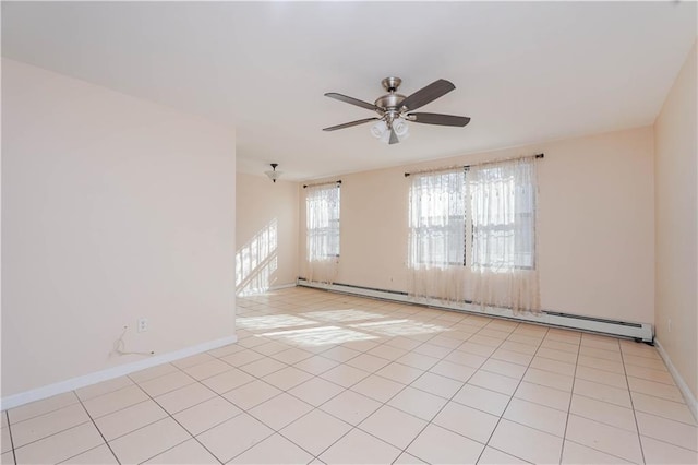 empty room featuring ceiling fan, light tile patterned floors, and baseboard heating