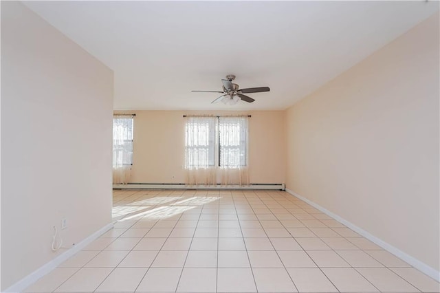 tiled empty room with ceiling fan and baseboard heating