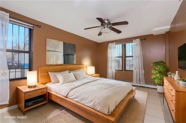 bedroom featuring light tile patterned flooring and ceiling fan