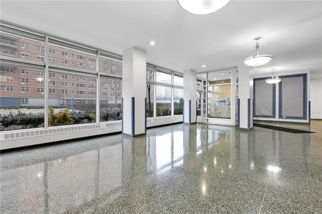 2930 W 5th St Unit 22G, Brooklyn, NY 11224 - unfurnished living room with a wall of windows and recessed lighting