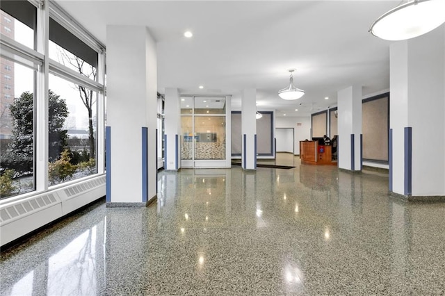 2930 W 5th St Unit 22G, Brooklyn, NY 11224 - unfurnished living room featuring baseboards, recessed lighting, and speckle patterned floor