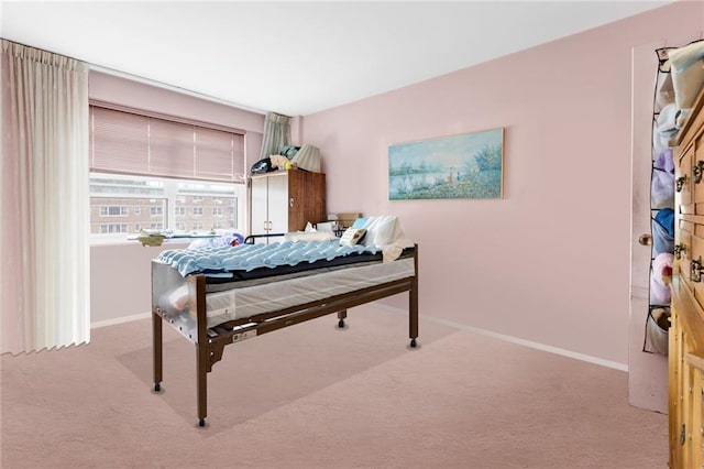 bedroom with light colored carpet