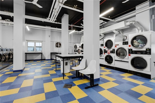 laundry room with stacked washer / dryer and washer and clothes dryer