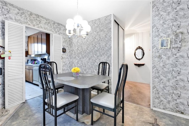 dining space with a notable chandelier and light tile patterned floors