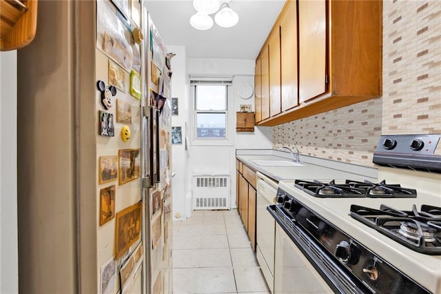 2930 W 5th St Unit 22G, Brooklyn, NY 11224 - kitchen featuring white appliances, brown cabinets, light countertops, and light tile patterned floors