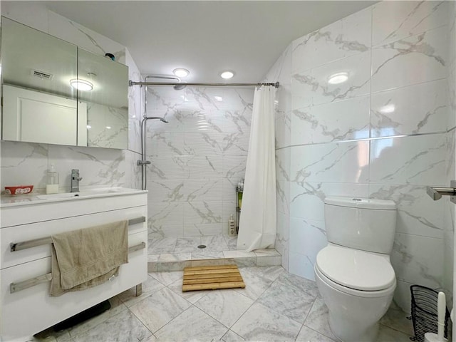 bathroom with a stall shower, visible vents, toilet, marble finish floor, and tile walls