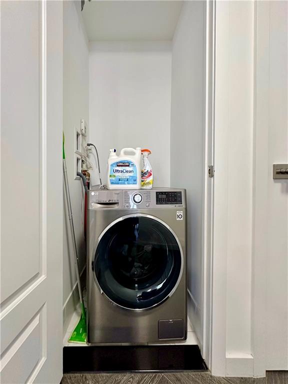 laundry area with laundry area and washer / clothes dryer