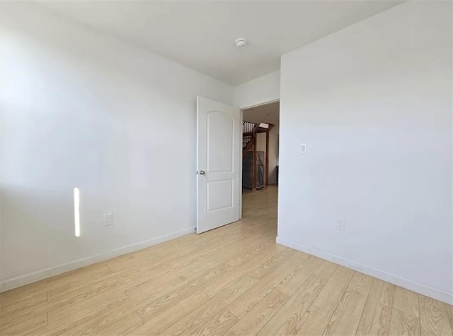 spare room featuring light hardwood / wood-style floors