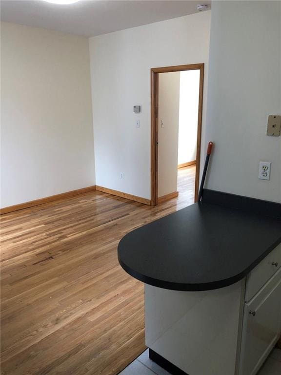 unfurnished dining area featuring light hardwood / wood-style flooring