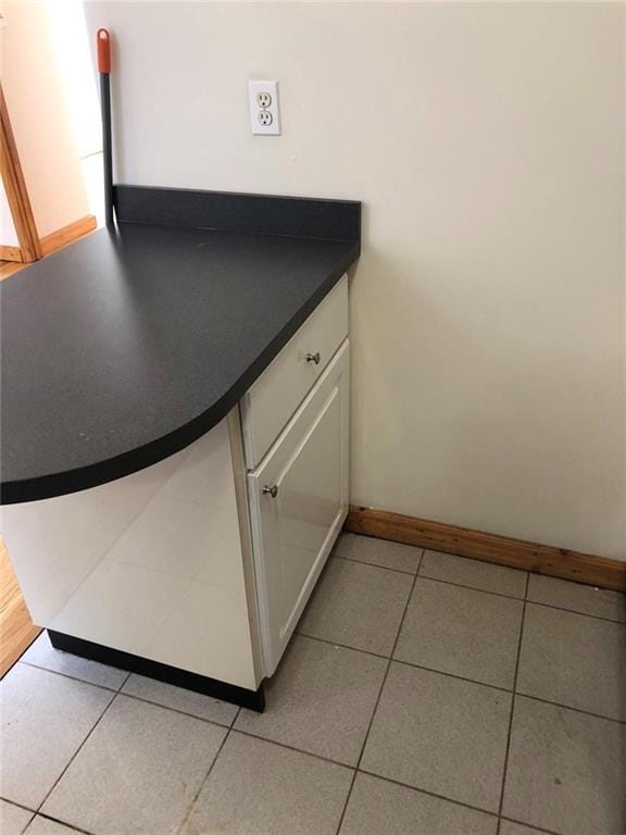 interior details featuring white cabinets