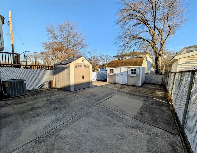 exterior space featuring a storage unit and central AC unit