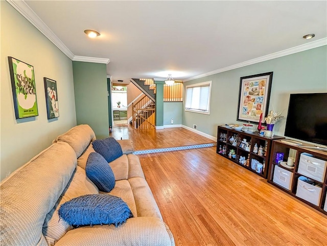 living room with crown molding, stairs, and wood finished floors